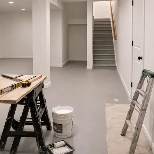 Basement renovation in progress with tools and clean finishes