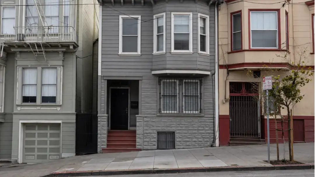 Front view of a remodeled Tenderloin San Francisco home with updated siding
